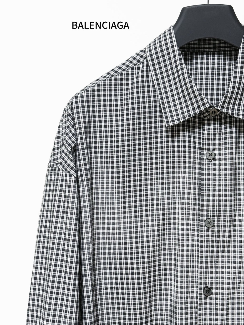 Checkered button-up shirt with pointed collar and front buttons, long sleeves