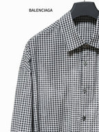 Checkered button-up shirt with pointed collar and front buttons, long sleeves