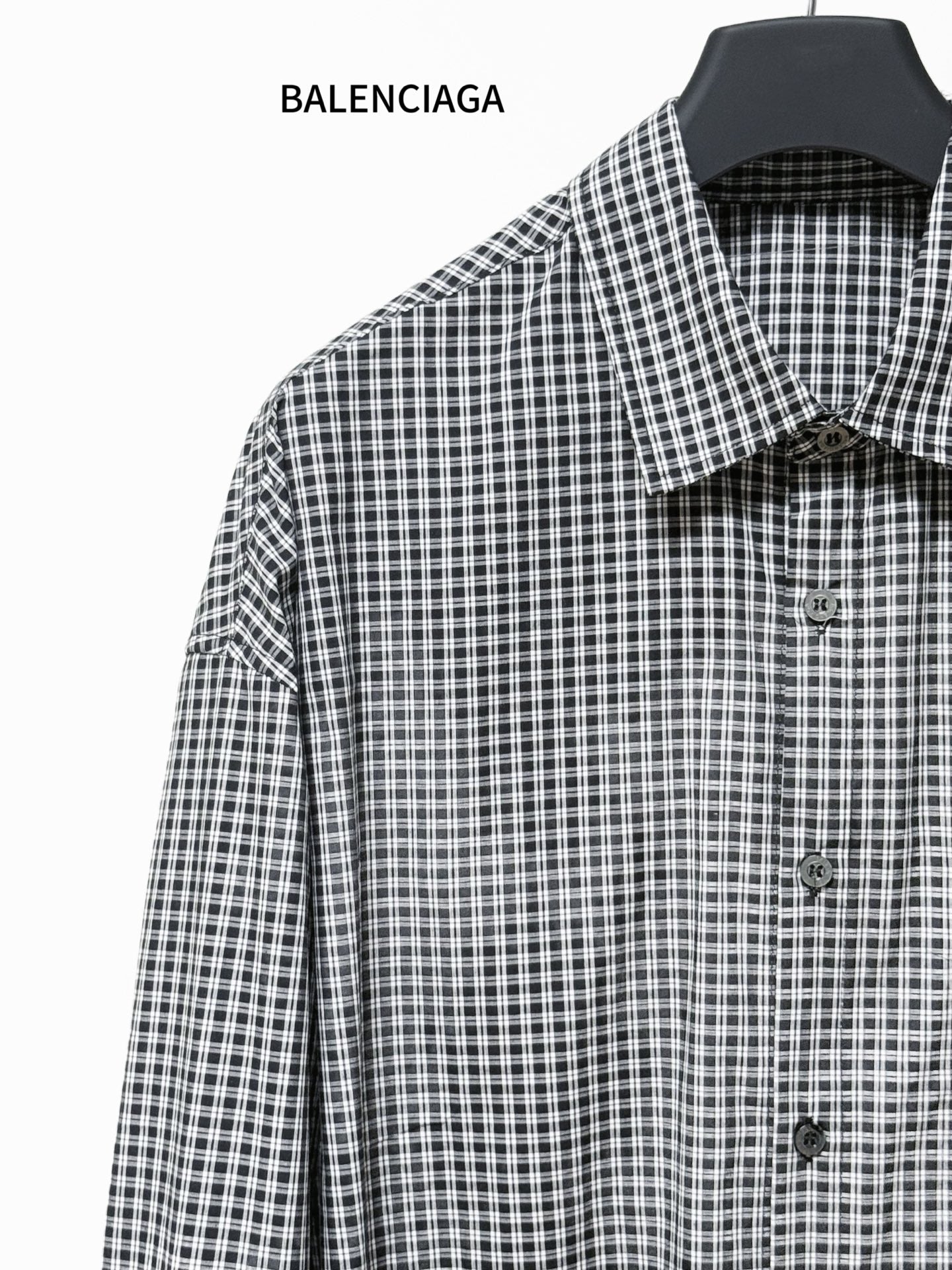Checkered button-up shirt with pointed collar and front buttons, long sleeves
