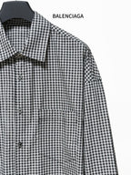 Checkered shirt detail with pointed collar and front button placket