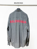 Checkered button-up shirt with BALENCIAGA text graphic on the back