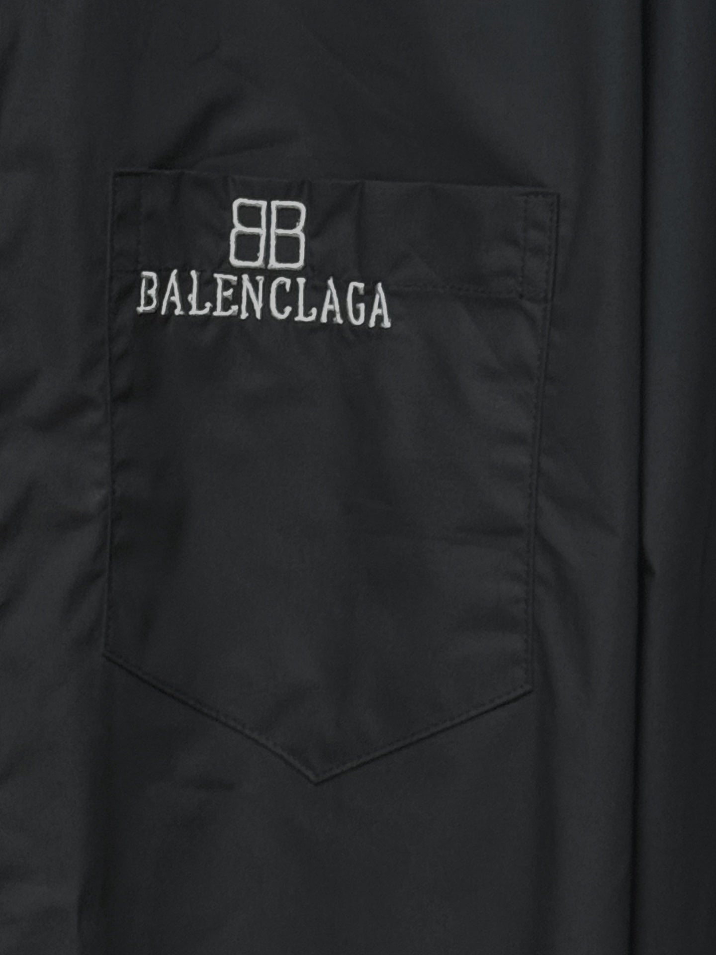 Dark shirt chest pocket with embroidered 8B and BALENCIAGA text