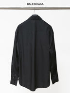 Dark long-sleeve button-up shirt, back view, button cuffs