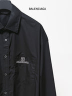 Dark long-sleeve shirt with front pocket and embroidered BALENCIAGA logo