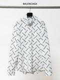 White long-sleeve button-up shirt with black Balenciaga logo allover print