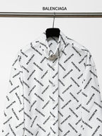 White long-sleeve button-up shirt with black Balenciaga logo print, front view