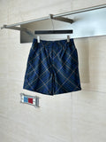 Navy plaid shorts with elastic waistband and drawstring, blue and tan check pattern