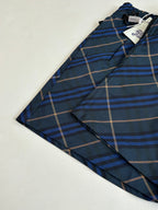 Navy plaid shorts laid flat with front button closure, blue and tan check pattern