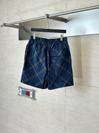 Blue plaid shorts with elastic waist and gathered front, navy with tan grid lines