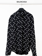 Black long-sleeve button-up shirt with allover Balenciaga logo print and pointed collar