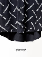 Black shirt hem with Balenciaga logo print and gathered lower edge detail