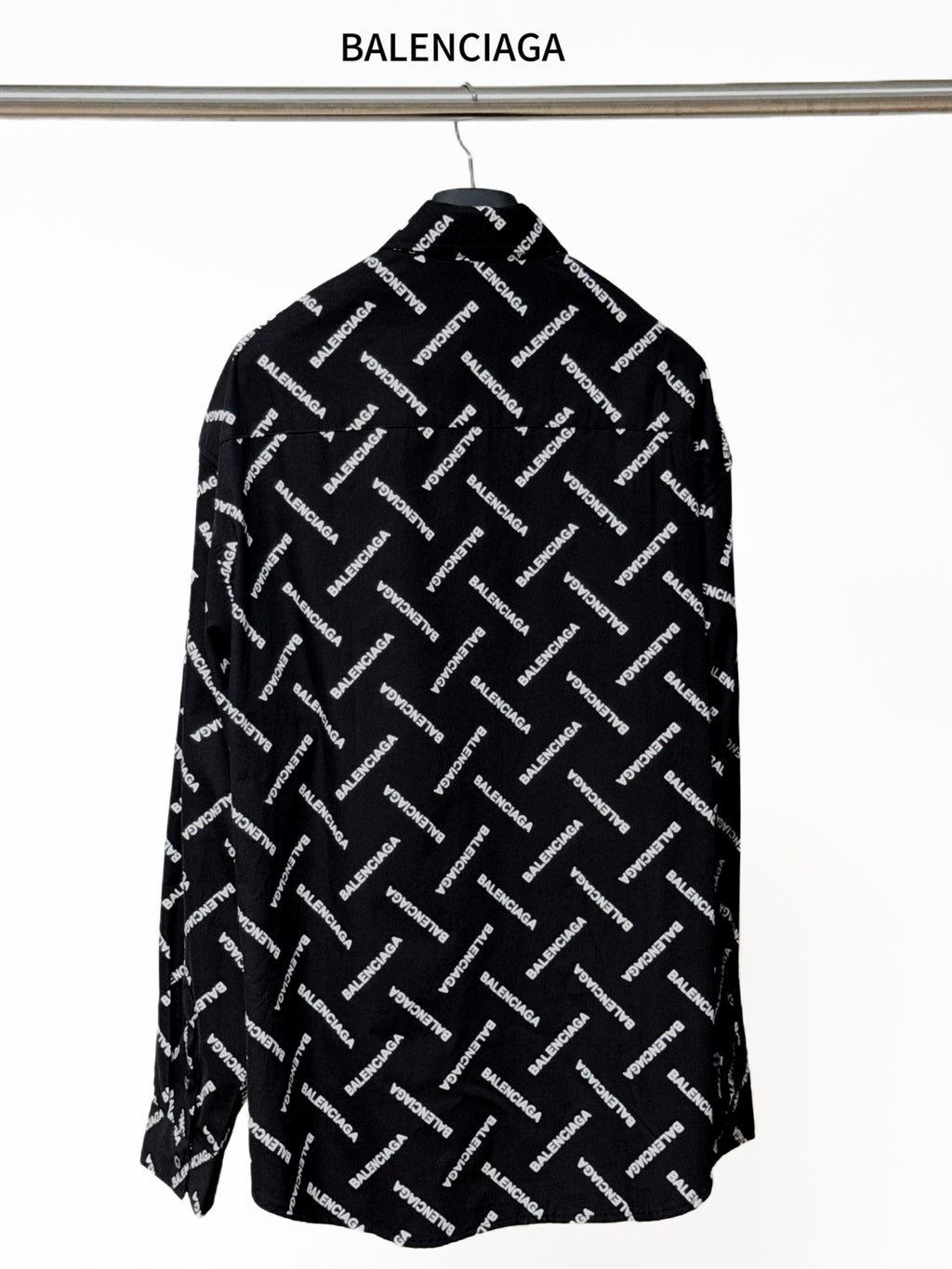 Black long-sleeve button-up shirt with allover Balenciaga logo print, back view