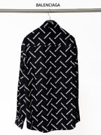 Black long-sleeve button-up shirt with allover Balenciaga logo print, back view
