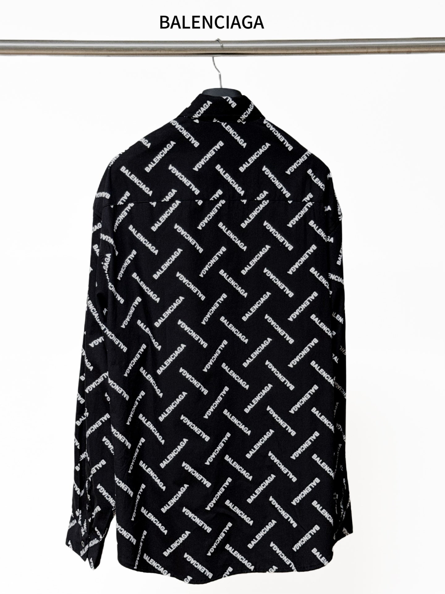 Black long-sleeve button-up shirt with allover Balenciaga logo print, back view
