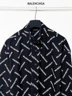 Black long-sleeve button-up shirt with Balenciaga logo pattern, full front view