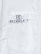 White chest pocket of long-sleeve button-up shirt with Balenciaga logo embroidery