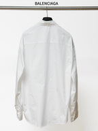 White long-sleeve button-up shirt, back view with yoke seams and logo detail