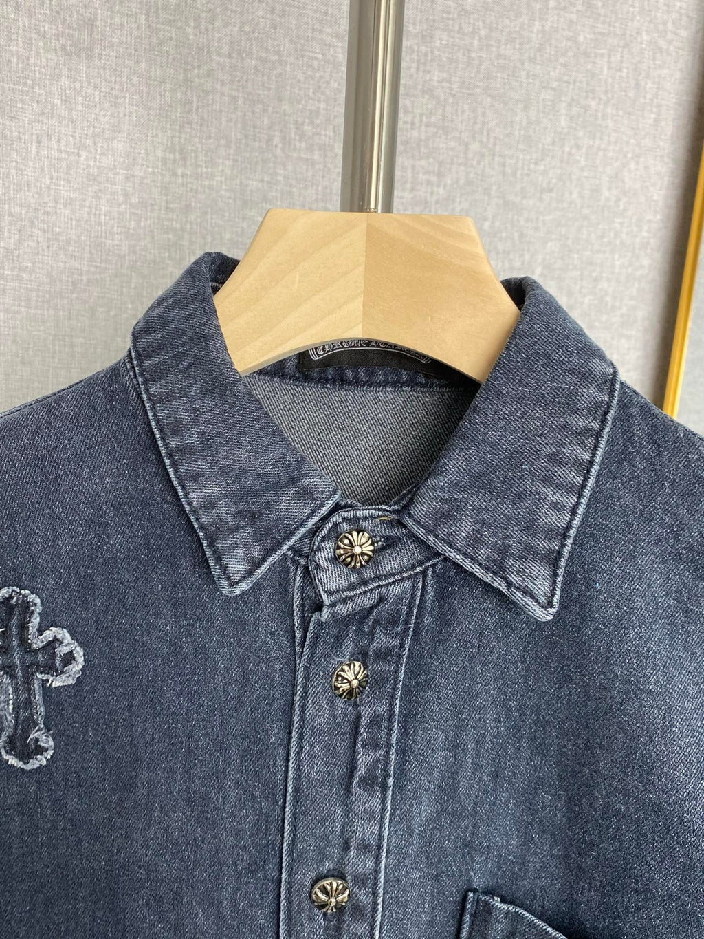 Denim jacket pointed collar, button placket, and small embroidered crosses