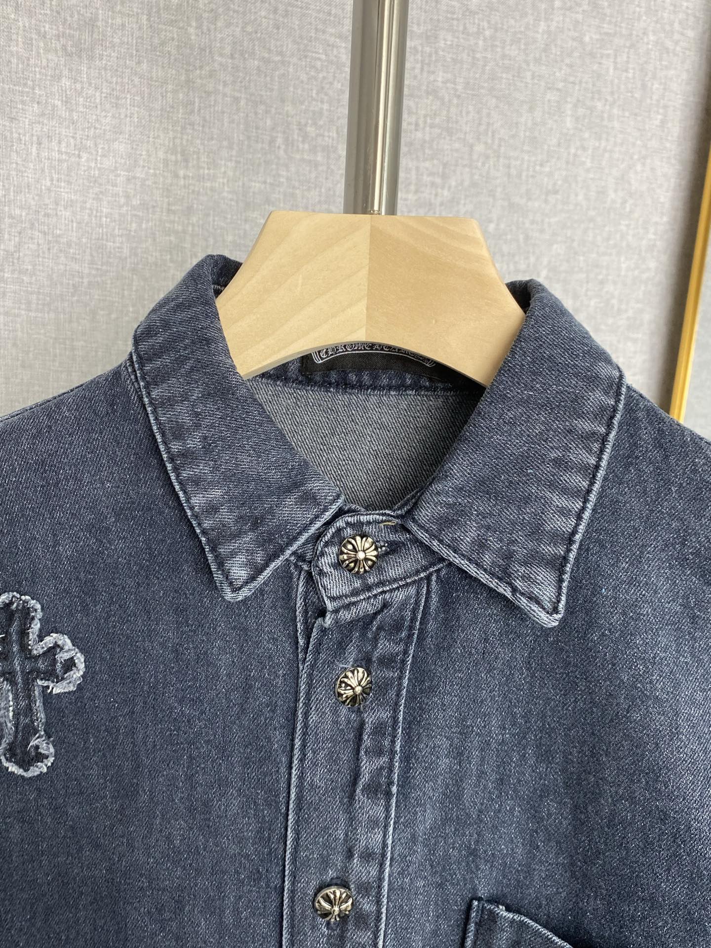 Denim jacket pointed collar, button placket, and small embroidered crosses