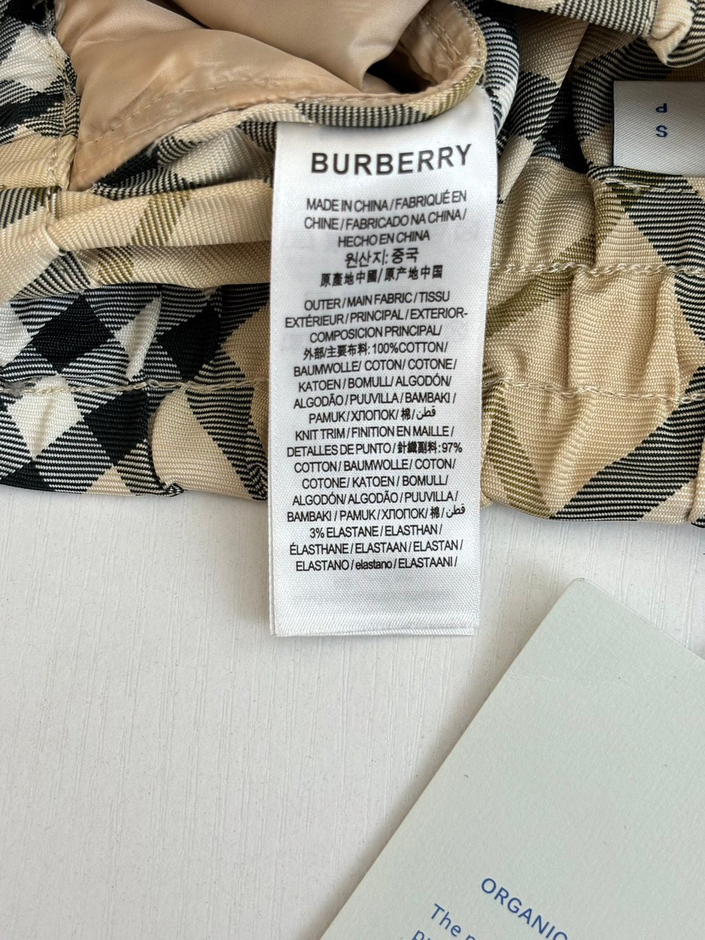 Burberry pants care label on check fabric waistband
