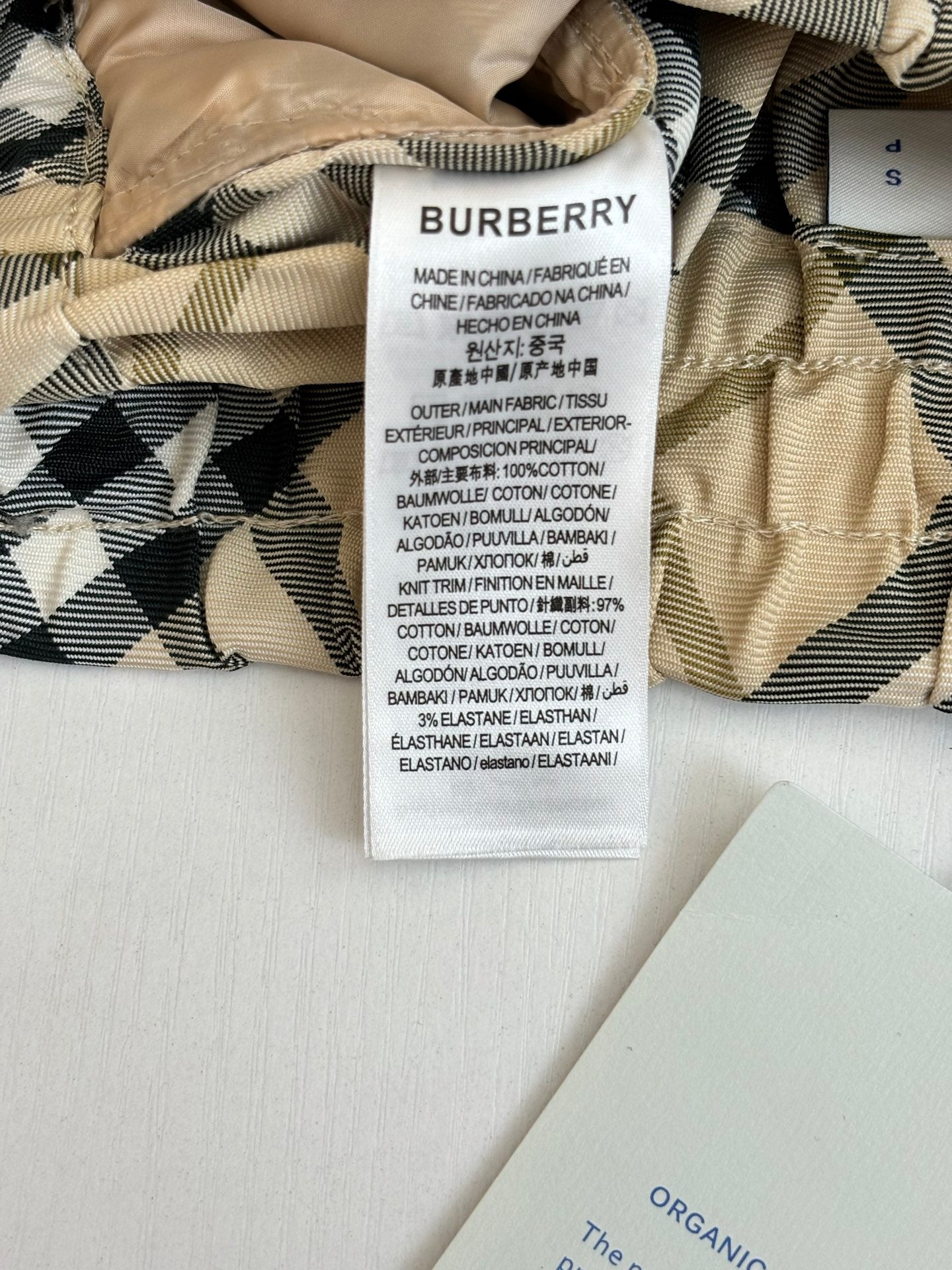 Burberry pants care label on check fabric waistband