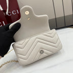 Small quilted mini shoulder bag with chevron pattern and snap button detail