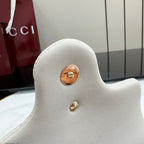White pebbled leather shoulder bag back with gold-tone button hardware