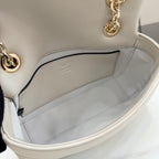 Off-white leather mini bag interior view with stitched lining and open top edge