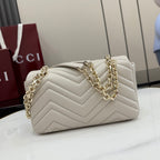 Off-white quilted leather shoulder bag with gold-tone chain and GG logo hardware detail