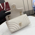 Off-white mini quilted leather bag with gold-tone chain strap and GG logo hardware