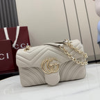 Off-white quilted leather shoulder bag with gold-tone chain strap and GG logo clasp