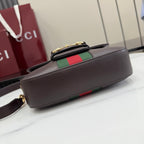 Dark brown leather mini bag with flap top, green and red stripe panel, gold clasp