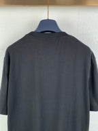 Black graphic T-shirt back view close-up of upper back fabric