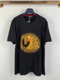 Black graphic T-shirt with gold circular horse emblem on the chest