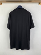 Black graphic T-shirt back view, plain with no visible front print