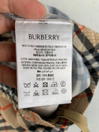 Burberry care label on plaid pants: Made in Italy, 100% silk blend fabric