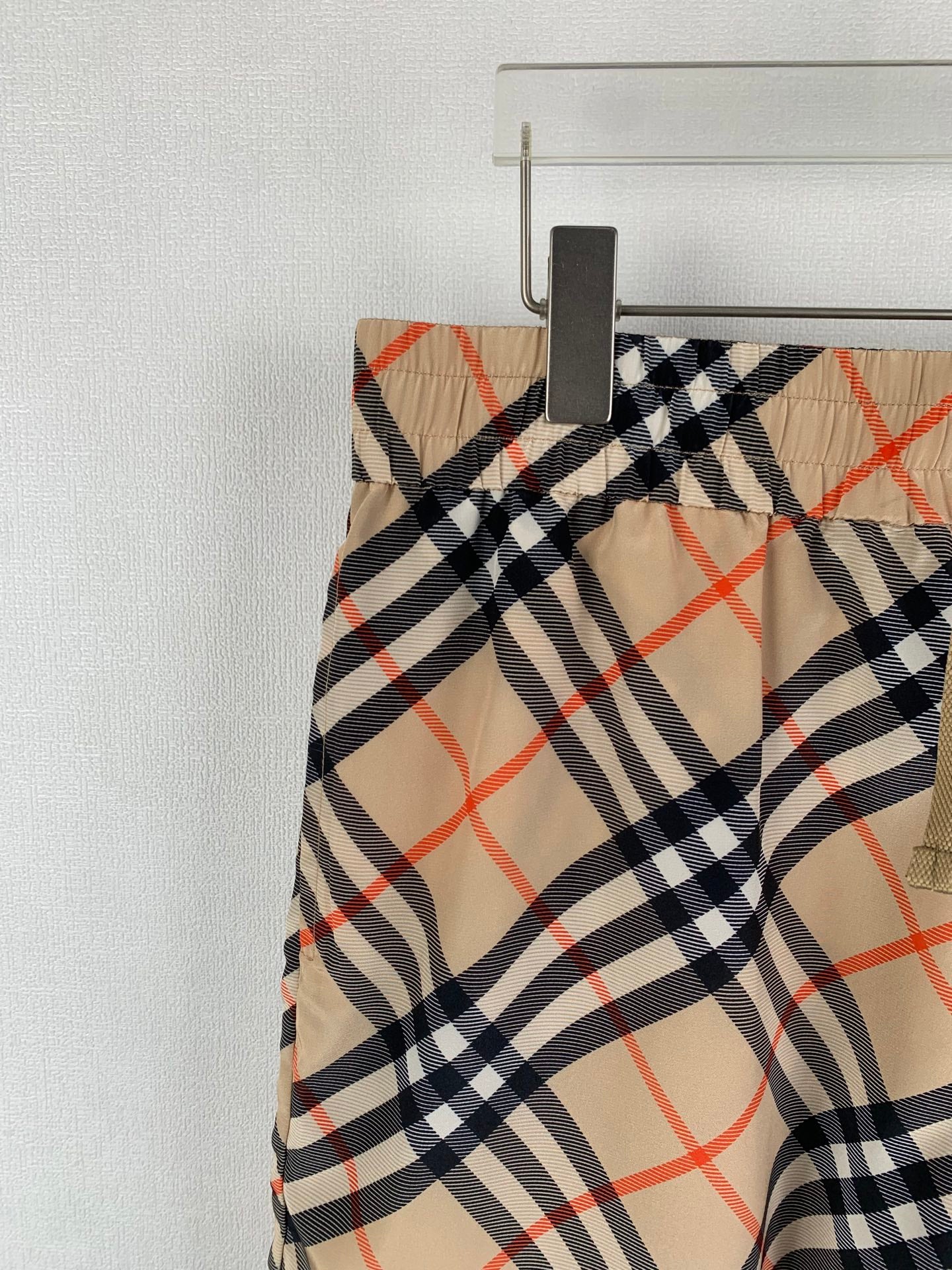 Burberry plaid pants side panel with beige lining and navy red check