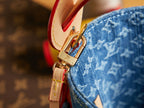 Red leather strap with gold clasp on blue monogram mini bag