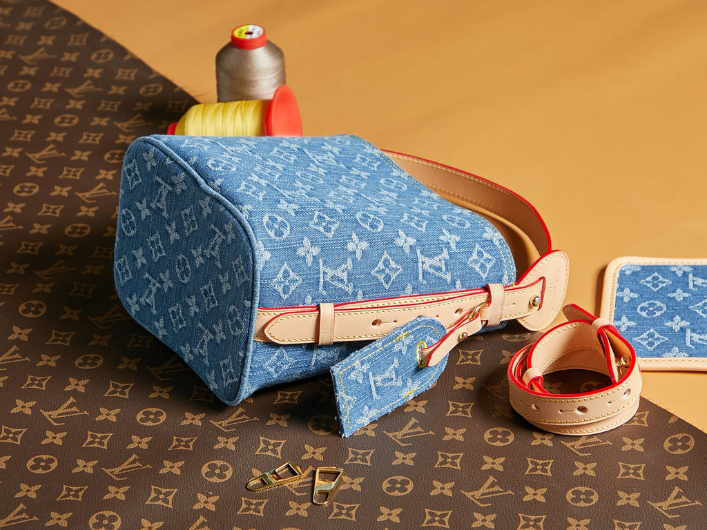 Blue monogram mini bag with red leather strap and zip top