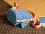 Blue monogram mini bag with red leather strap and zip top