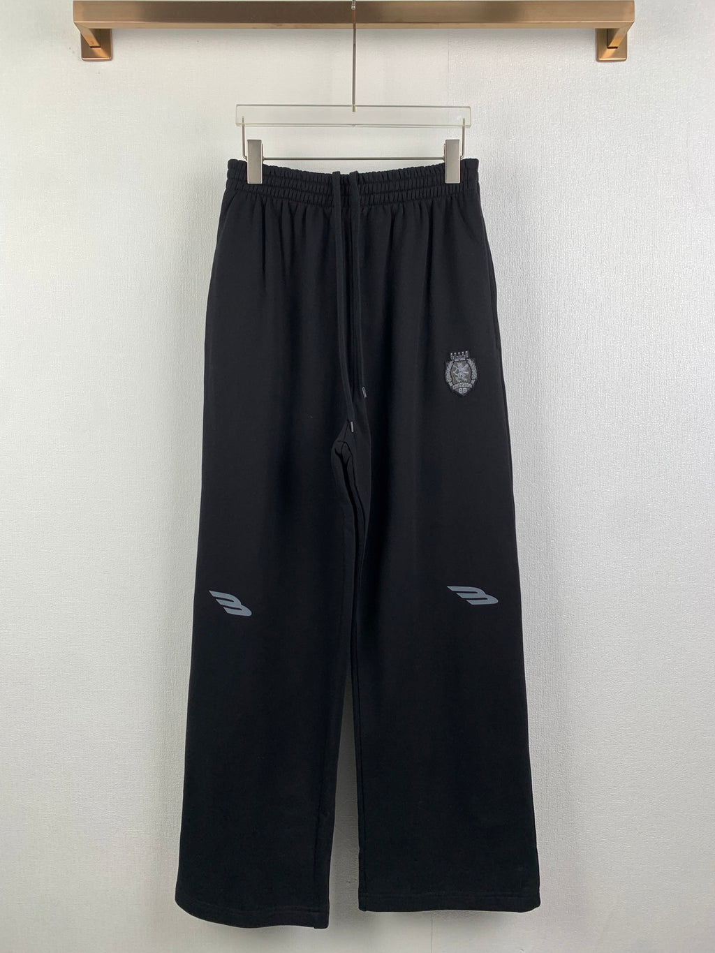 Balenciaga pants with elastic waist, dark wide-leg track style and drawstring