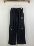 Balenciaga pants with elastic waist, dark wide-leg track style and drawstring