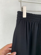 Balenciaga pants with elastic waist and dark front pleats
