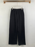 Balenciaga pants with elastic waist, dark wide straight legs, cuffed hem