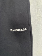 Dark knit fabric panel with BALENCIAGA logo patch
