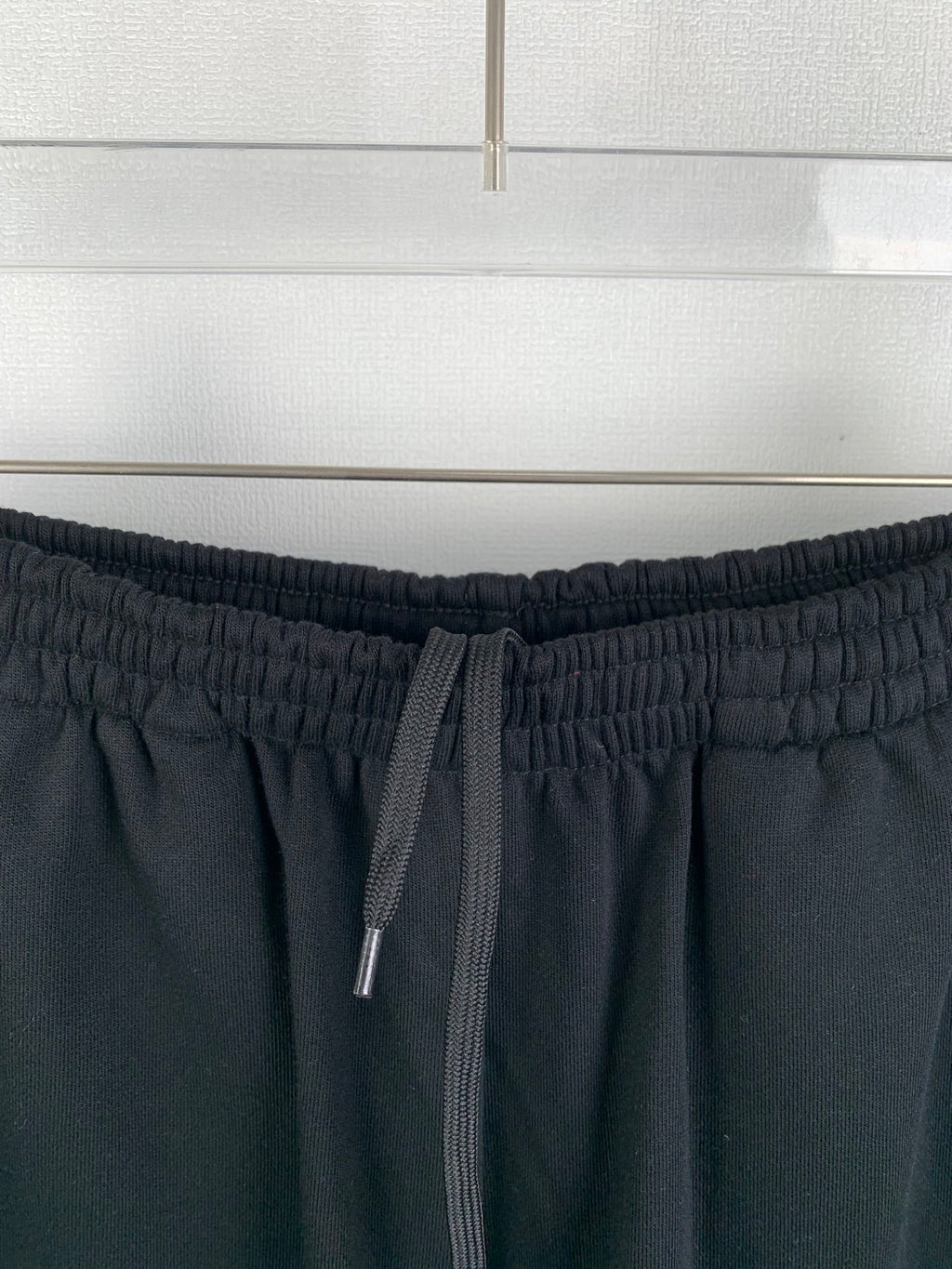 Dark knit shorts with drawstring ties and elastic waistband