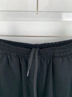 Dark knit shorts with drawstring ties and elastic waistband