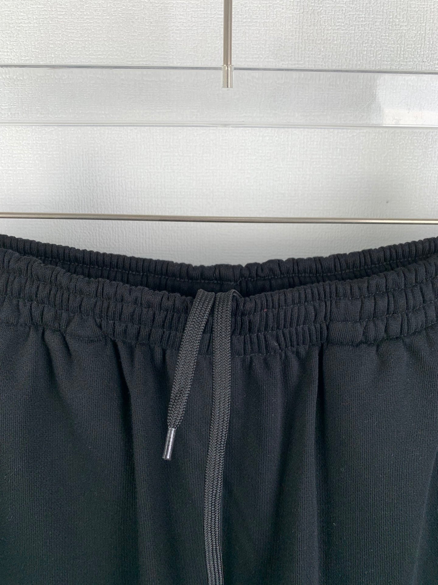 Dark knit shorts with drawstring ties and elastic waistband