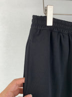 Dark knit shorts with elastic waistband and inner seam detail