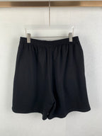 Dark knit shorts with elastic waistband and drawstring front